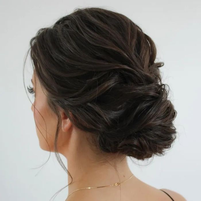 Messy textured bun with holiday sparkle