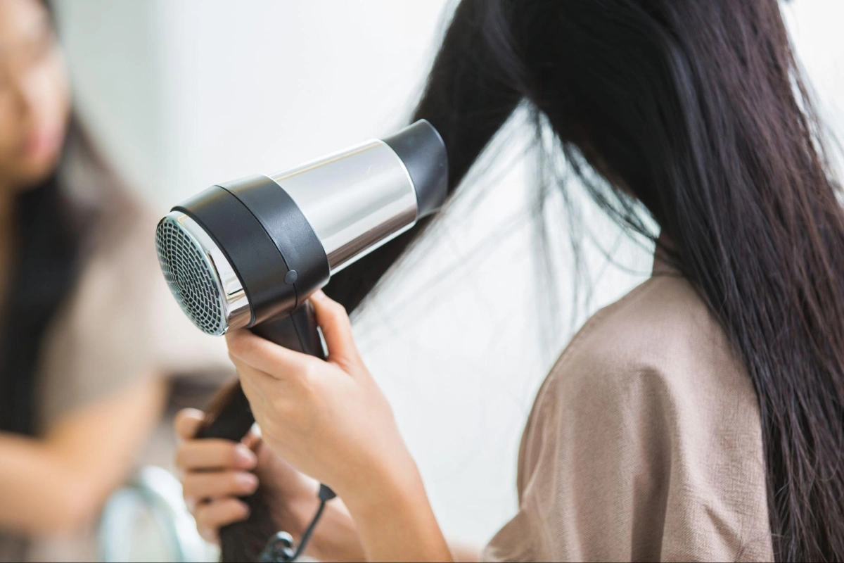 The reason your hair gets tangled with the hair dryer is because you dry it too much