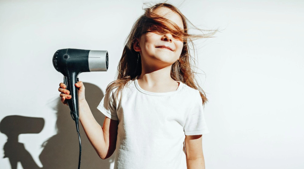 At what age should children use their own hair dryer?