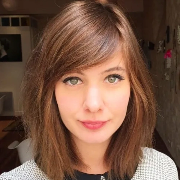 Wide, side-swept bangs