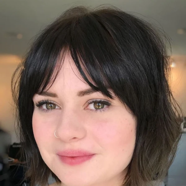 Curtain bangs hairstyle for round face