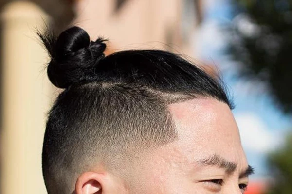 Man bun hairstyle for round face