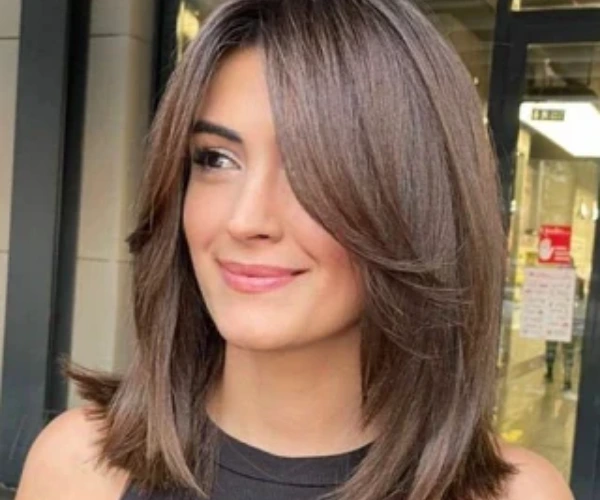 The layered lob haircut for pear face shape