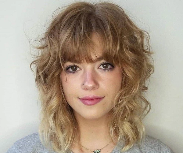 Short shag hairstyle for women with curly hair