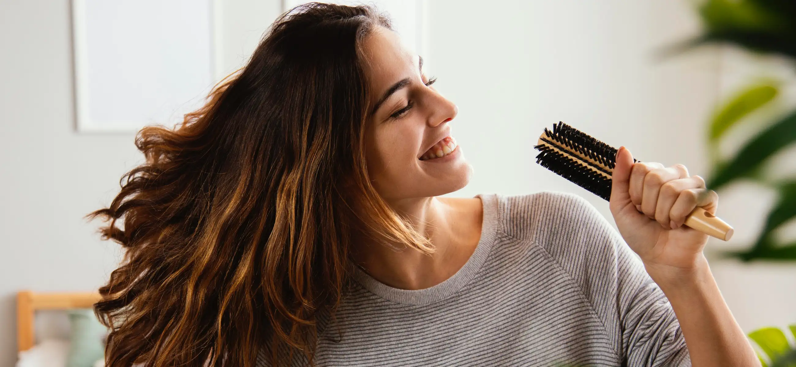 How to blow dry hair with a round brush for curly and wavy hair