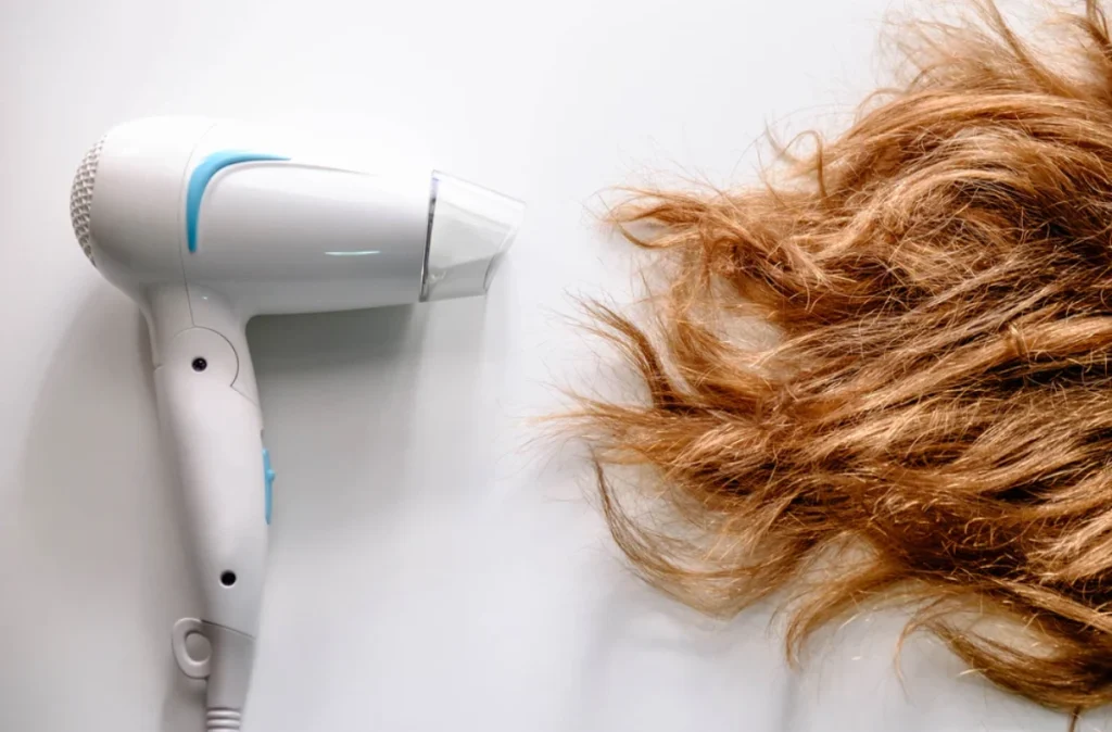 Why does a normal hair dryer cause heat damage?